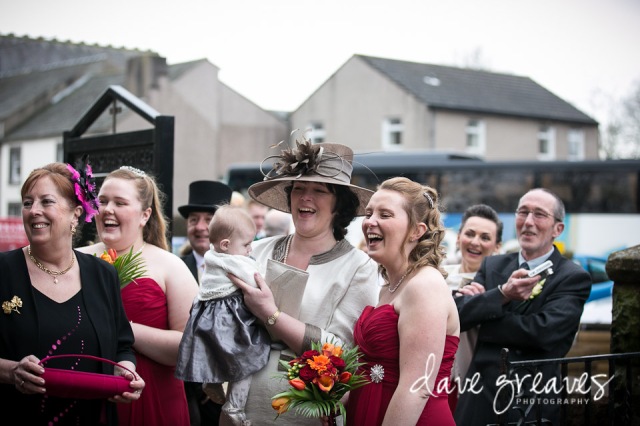 Guests and bridesmaids laughing at wedding