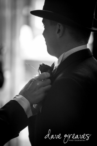 Groom in top hat and tails taken in Black and white 