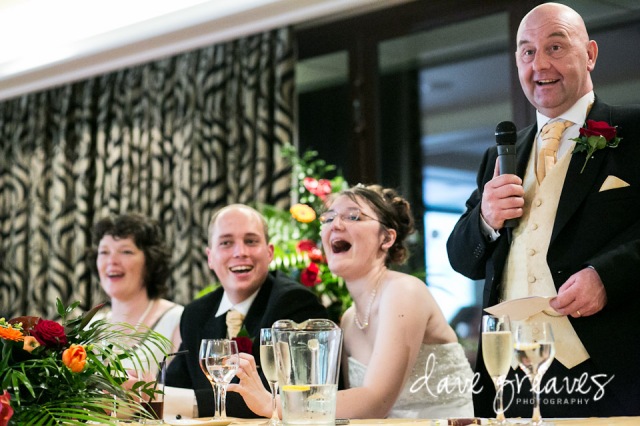 Fater of the Bride Speech with daughter laughing and groom smiling