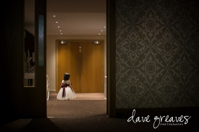 Flower girl standing in a doorway at Armathwaite Hall