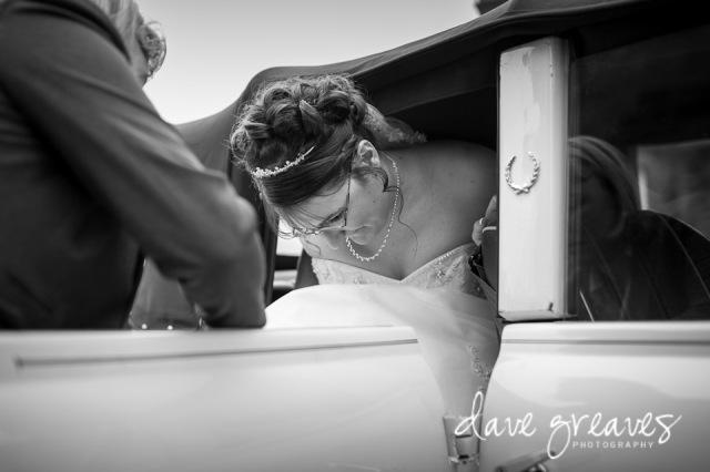 Bride climbs out of the car at St Mary's church Wigton
